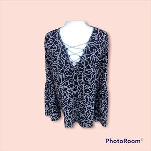 Women’s blouse with silver chain and flared sleeves